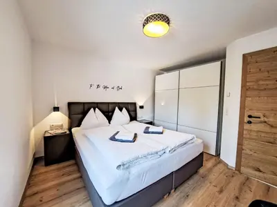 Ein Bett oder Betten in einem Zimmer der Unterkunft Apartment Alpine Residence Auszeit-1 by Interhome