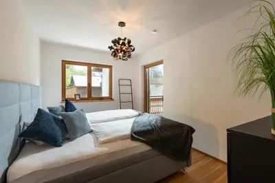 Ein Bett oder Betten in einem Zimmer der Unterkunft Apartment Seeglück am Walchsee - sehr stylisch, zentral und neuerbaut