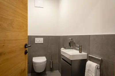 Ein Badezimmer in der Unterkunft Apartment Seeglück am Walchsee - sehr stylisch, zentral und neuerbaut