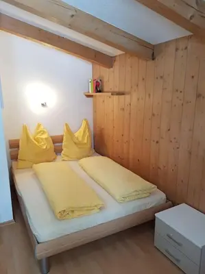 Ein Bett oder Betten in einem Zimmer der Unterkunft Gemütliche Wohnung mit Blick auf den Zahmen Kaiser