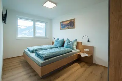 Ein Bett oder Betten in einem Zimmer der Unterkunft Apart Ausblick