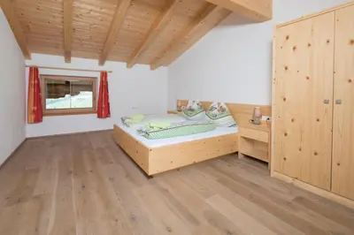 Ein Bett oder Betten in einem Zimmer der Unterkunft Bauernhaus Roßmoos
