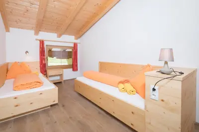 Ein Bett oder Betten in einem Zimmer der Unterkunft Bauernhaus Roßmoos