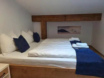 Ein Bett oder Betten in einem Zimmer der Unterkunft MountApart Ski in - Ski out
