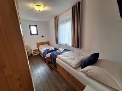 Ein Bett oder Betten in einem Zimmer der Unterkunft MountApart Ski in - Ski out