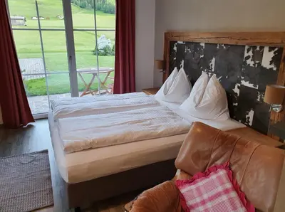 Ein Bett oder Betten in einem Zimmer der Unterkunft Romantik Pension Lehrberg