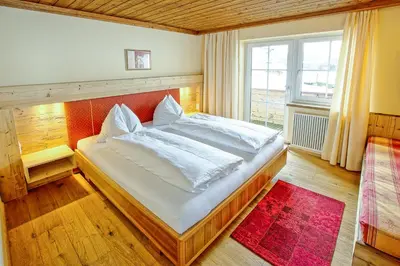Ein Bett oder Betten in einem Zimmer der Unterkunft Romantik Pension Lehrberg