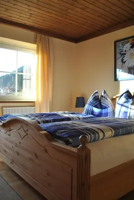 Ein Bett oder Betten in einem Zimmer der Unterkunft Romantik Pension Lehrberg