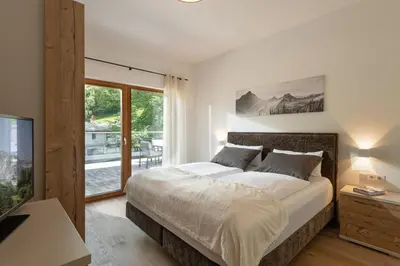 Ein Bett oder Betten in einem Zimmer der Unterkunft Penthouse Bergseetraum mit 102 qm Dachterrasse
