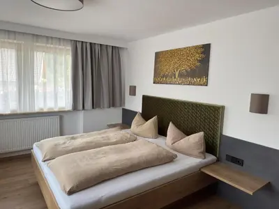 Ein Bett oder Betten in einem Zimmer der Unterkunft Binder's Saghaus