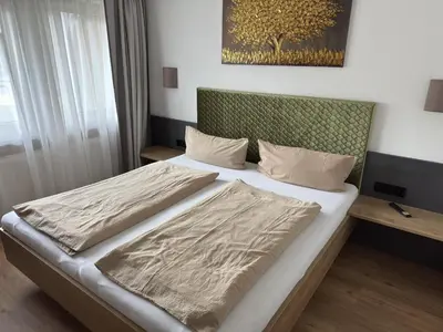 Ein Bett oder Betten in einem Zimmer der Unterkunft Binder's Saghaus