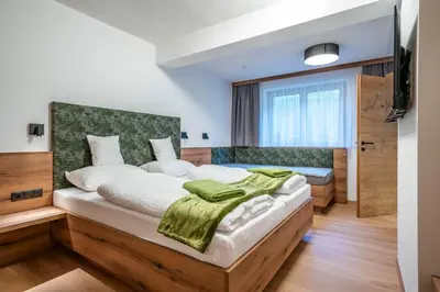 Ein Bett oder Betten in einem Zimmer der Unterkunft Apart Kreuzjoch