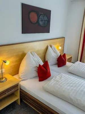 Ein Bett oder Betten in einem Zimmer der Unterkunft Hotel Sommerer - Hike & Bike in Saalbach, Joker Card inkl