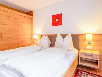 Ein Bett oder Betten in einem Zimmer der Unterkunft Ronacher