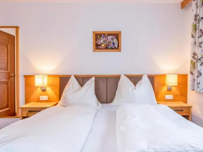 Ein Bett oder Betten in einem Zimmer der Unterkunft Ronacher