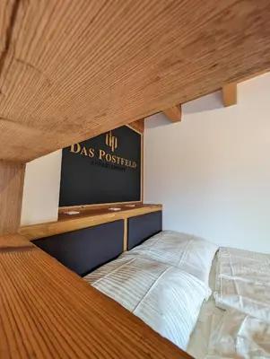 Ein Bett oder Betten in einem Zimmer der Unterkunft Das Postfeld Appartement