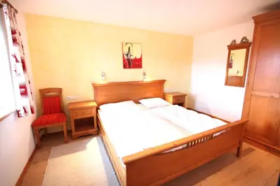 Ein Bett oder Betten in einem Zimmer der Unterkunft Ferienwohnung Königsleiten 37 - Top 2