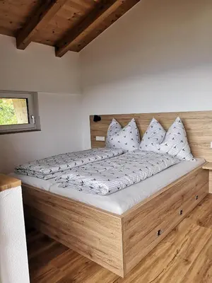 Ein Bett oder Betten in einem Zimmer der Unterkunft Ferienwohnung Buchmann