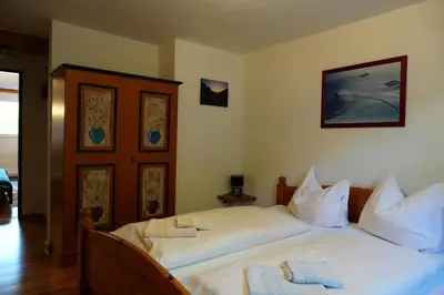 Ein Bett oder Betten in einem Zimmer der Unterkunft Apartmentpension Hillebrand