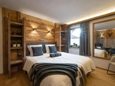 Ein Bett oder Betten in einem Zimmer der Unterkunft Alpine Lodge Brixen