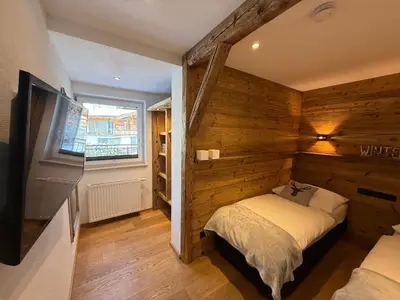 Ein Bett oder Betten in einem Zimmer der Unterkunft Alpine Lodge Brixen