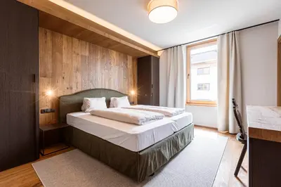 Ein Bett oder Betten in einem Zimmer der Unterkunft Chalet 104 Westendorf by ALPS RESORTS