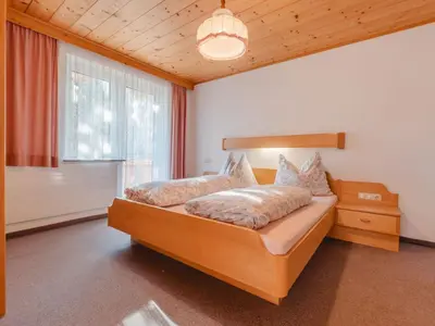 Ein Bett oder Betten in einem Zimmer der Unterkunft Apartment Mitterkopf by Interhome