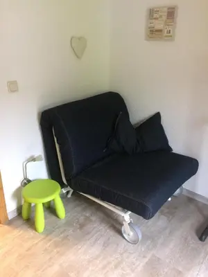 Ein Sitzbereich in der Unterkunft Pension Obwiesen