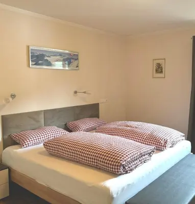 Ein Bett oder Betten in einem Zimmer der Unterkunft Hollys Ferienwohnungen