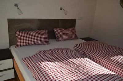 Ein Bett oder Betten in einem Zimmer der Unterkunft Hollys Ferienwohnungen