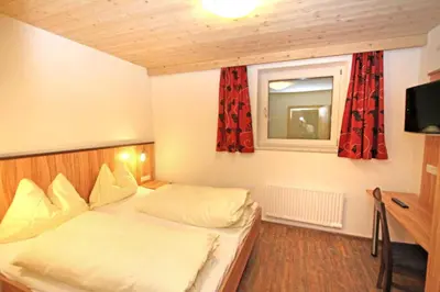 Ein Bett oder Betten in einem Zimmer der Unterkunft Ferienwohnung Königsleiten 2 - Top 4