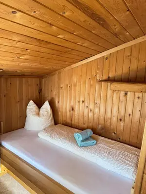 Ein Bett oder Betten in einem Zimmer der Unterkunft Sepplhütte