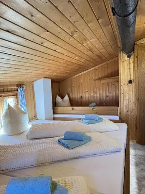 Ein Bett oder Betten in einem Zimmer der Unterkunft Sepplhütte