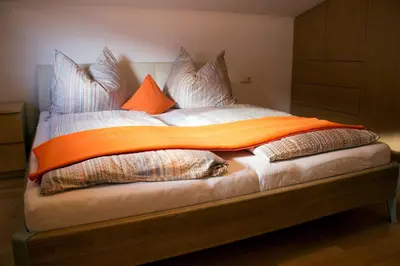 Ein Bett oder Betten in einem Zimmer der Unterkunft Ferienwohnung Kitzbichler im Kaiserwinkl
