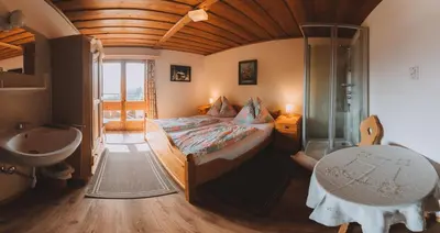 Ein Bett oder Betten in einem Zimmer der Unterkunft Berghotel Breitmoos