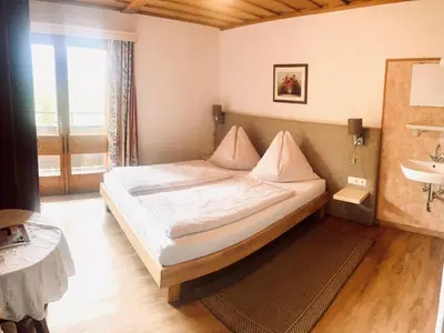 Ein Bett oder Betten in einem Zimmer der Unterkunft Berghotel Breitmoos