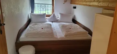 Ein Bett oder Betten in einem Zimmer der Unterkunft Ferienwohnungen Pfister