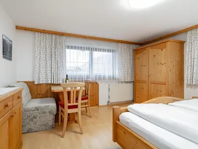 Ein Bett oder Betten in einem Zimmer der Unterkunft Schleicherhof IV