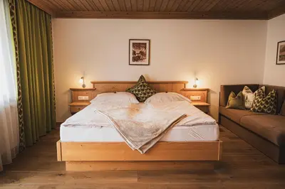 Ein Bett oder Betten in einem Zimmer der Unterkunft Gästehaus Einödberg