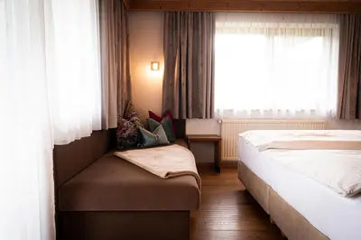 Ein Bett oder Betten in einem Zimmer der Unterkunft Gästehaus Einödberg