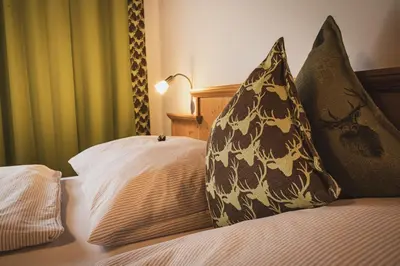 Ein Bett oder Betten in einem Zimmer der Unterkunft Gästehaus Einödberg