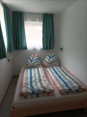 Ein Bett oder Betten in einem Zimmer der Unterkunft Ferienwohnung Innergreit