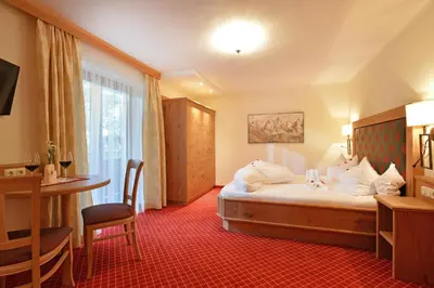 Ein Bett oder Betten in einem Zimmer der Unterkunft Hotel Garni Bavaria