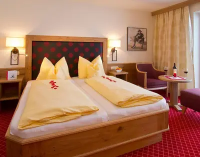 Ein Bett oder Betten in einem Zimmer der Unterkunft Hotel Garni Bavaria