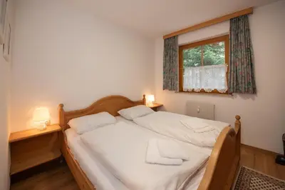 Ein Bett oder Betten in einem Zimmer der Unterkunft Chalet Alpine Royal B Top 20