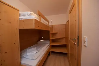 Ein Bett oder Betten in einem Zimmer der Unterkunft Almhäuser Filzsteinalpe Almhaus 201