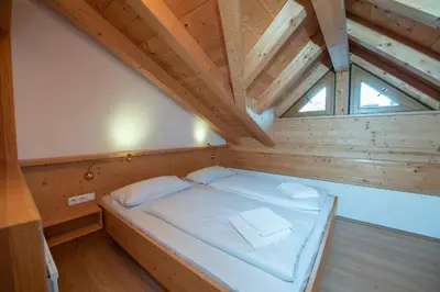 Ein Bett oder Betten in einem Zimmer der Unterkunft Almhäuser Filzsteinalpe Almhaus 201