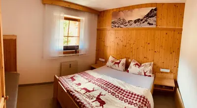 Ein Bett oder Betten in einem Zimmer der Unterkunft Chalet Alpine Royal A Top 11