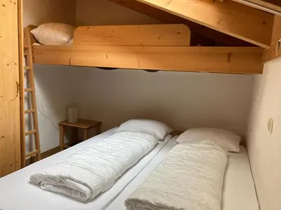Ein Bett oder Betten in einem Zimmer der Unterkunft Haus 129 Top 3