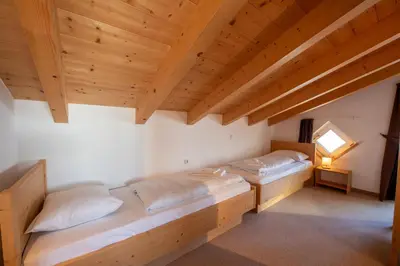 Ein Bett oder Betten in einem Zimmer der Unterkunft Haus 130 Top 3